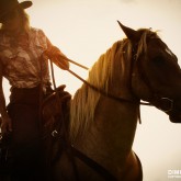 Cowboy Girl Riding Horse Into The Sunset
