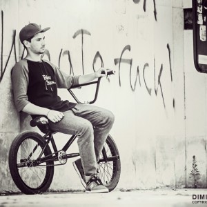 Portrait of the bicyclist sitting on BMX