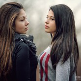 Outdoor portrait of two beautiful young girls