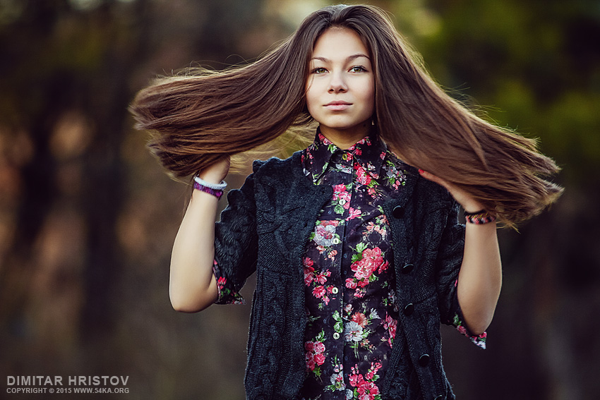 Young girl fashion portraits in an outdoor park photography portraits fashion  Photo