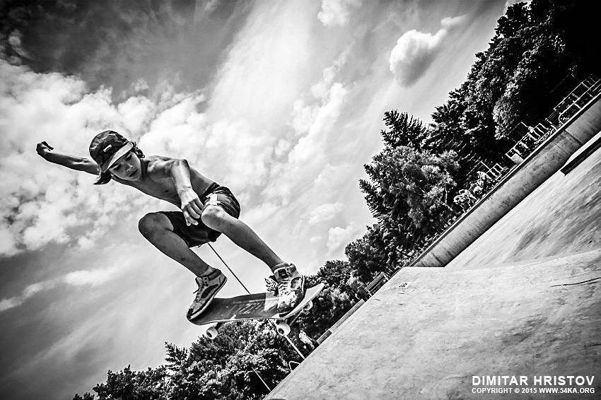 Boy with skateboard is going airborne photography other extreme black and white  Photo