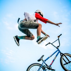 Young Boy Is Jumping With Bmx