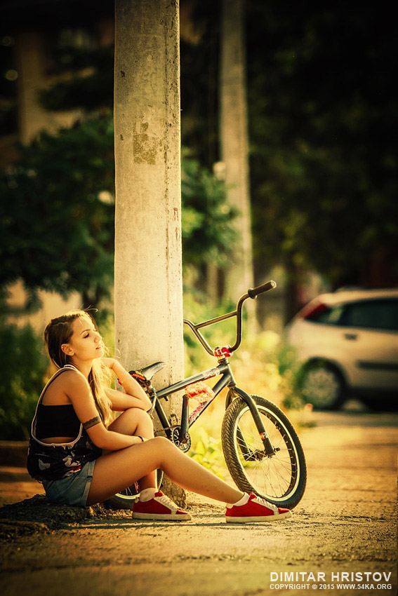 Young girl with bmx on the sunset street photography portraits  Photo