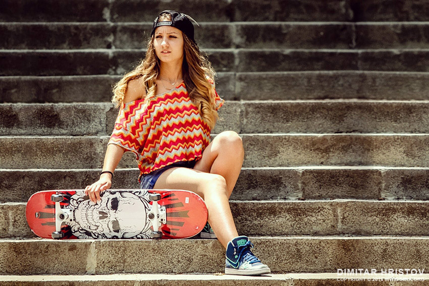 Girl with skateboard sitting on the stairs daily dose  Photo
