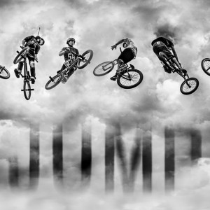 High BMX jump in a stormy sky