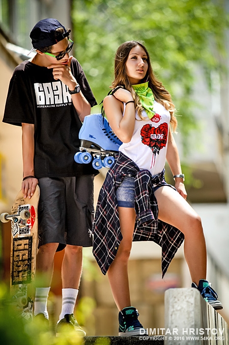 Teenage girl and boy with skateboards and roller skates outdoor portrait photography portraits fashion  Photo