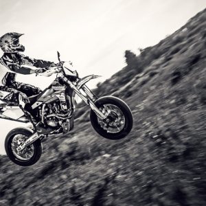 Biker making a stunt and jumps in the air