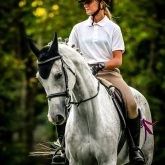 Girl riding white arabian horse