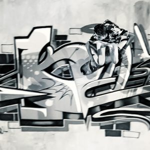 Boy riding skateboard in graffiti drawing pool