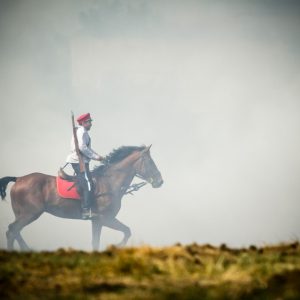 Cavalryman on a horse riding in a mist