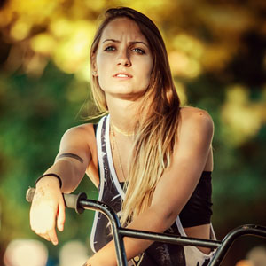 Young girl riding BMX bicycle