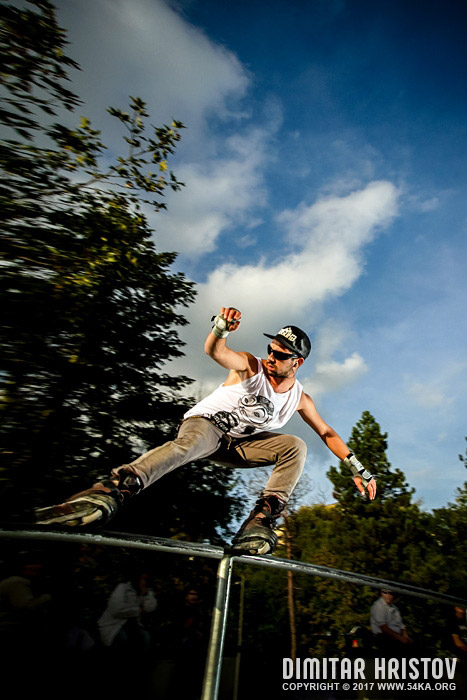 Aggressive inline roller blader grind on the rail photography extreme  Photo