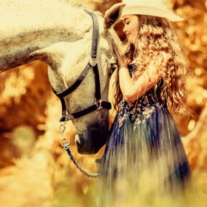 Cute girl with beautiful white horse