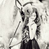 Young Girl with beautiful white horse