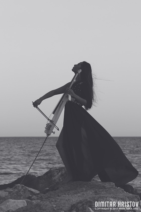 Woman with a cello on the coastline photography portraits featured black and white  Photo