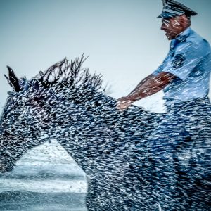 Policeman Riding Horse in The Storm