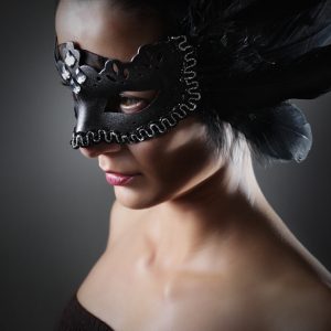 Girl with a black raven feather mask