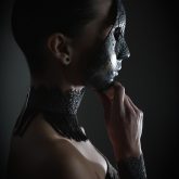 Girl with full face Venetian mask closeup
