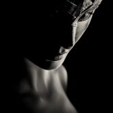Low key portrait photography of a girl with Venetian mask