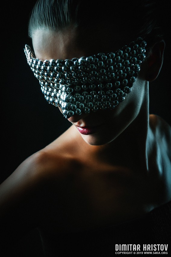 Pretty girl with conceptual silver eye carnival mask photography venetian eye mask portraits featured fashion  Photo