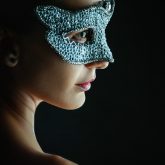 Woman wearing venetian masquerade mask