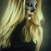 Girl with domino eye mask
