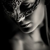 Mysterious woman with fantasy mask