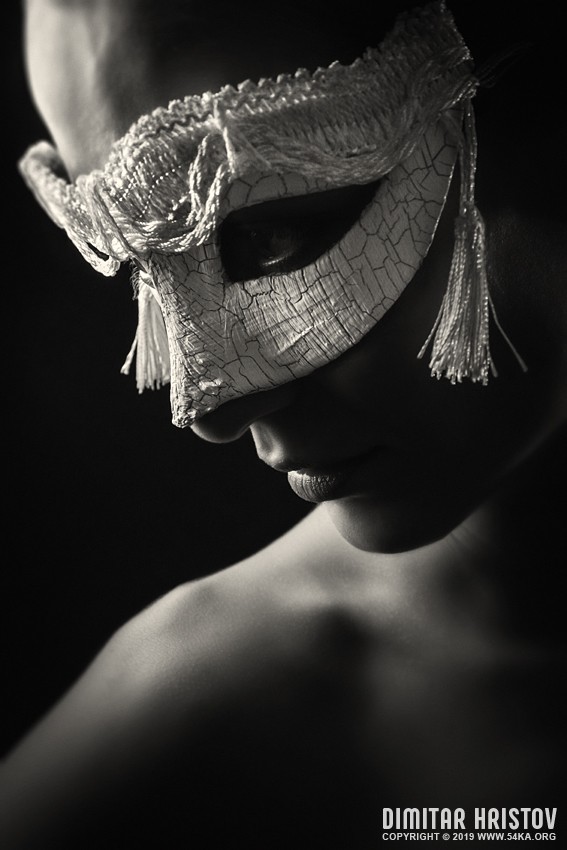 Portrait of a girl with white venetian mask photography venetian eye mask portraits featured fashion black and white  Photo
