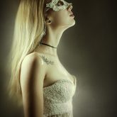 Portrait of girl with beautiful white lace mask