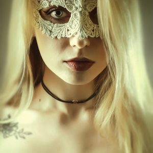 Woman with beautiful white lace mask