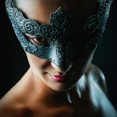 Strobist portrait of a girl with superhero mask