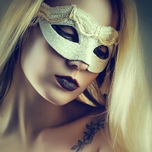 A gentle portrait of a girl with a white Venetian mask