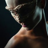 Beauty sensual portrait of a girl with mask