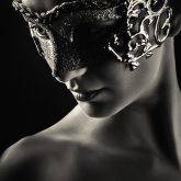 Girl with vintage venetian mask in black and white