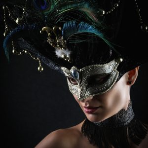 Girl with peacock feathers mask