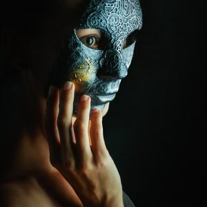 Women with full face Venetian masquerade masks