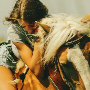 Gentle portrait of a woman and a horse