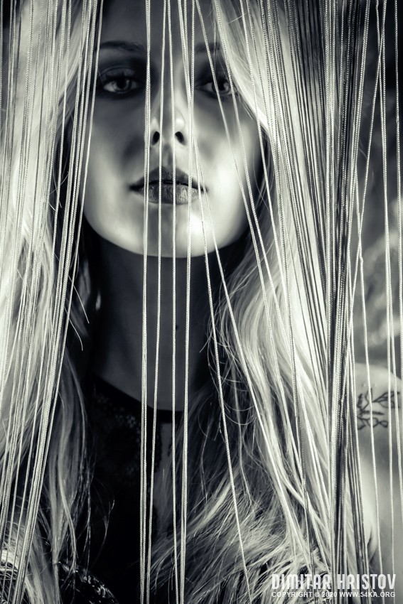 Glamorous woman in dress posing behind curtains photography portraits daily dose black and white  Photo