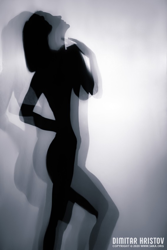 Silhouette of young woman on white background – Studio Art Photography