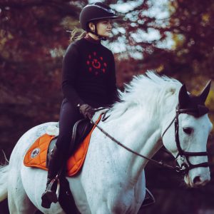 Girl riding white horse